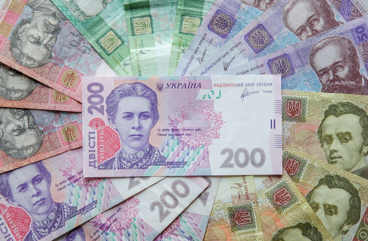 Hrivna a atins un minim istoric față de dolar, în contextul presiunilor economice din Ucraina